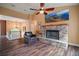 Spacious living area enhanced by a stone fireplace and views to the open staircase at 4673 Se 115Th St, Belleview, FL 34420