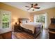 Spacious main bedroom with ensuite access and private balcony at 4673 Se 115Th St, Belleview, FL 34420