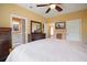 Main bedroom with adjoining bath, wood floors and ample natural light at 4673 Se 115Th St, Belleview, FL 34420