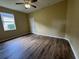 Bedroom featuring vinyl flooring, a window view, and neutral colored walls at 4940 Sw 63Rd Loop, Ocala, FL 34474