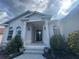Charming single-story home featuring a covered front porch and arched windows at 4940 Sw 63Rd Loop, Ocala, FL 34474