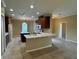 Spacious kitchen with white countertops and brown cabinets at 4940 Sw 63Rd Loop, Ocala, FL 34474