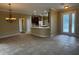 Spacious living area with tile flooring and direct access to the kitchen at 4940 Sw 63Rd Loop, Ocala, FL 34474