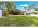 Spacious, grassy, fenced backyard with home and small shed at 5005 Ne 22Nd Ave, Ocala, FL 34479