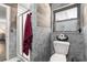 Bathroom with decorative gray tile, glass shower, and modern fixtures at 5005 Ne 22Nd Ave, Ocala, FL 34479
