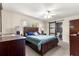 Bedroom featuring carpeted floors, a cozy bed and an ensuite bathroom at 5005 Ne 22Nd Ave, Ocala, FL 34479