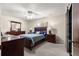 Bedroom featuring carpeted floors, a cozy bed and wood furniture at 5005 Ne 22Nd Ave, Ocala, FL 34479