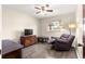 Cozy bedroom with a ceiling fan, a window providing natural light and laminate floors at 5005 Ne 22Nd Ave, Ocala, FL 34479