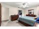 Bedroom featuring carpeted floors, a bed and closet with white doors at 5005 Ne 22Nd Ave, Ocala, FL 34479