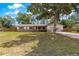 Charming single-story home with a well-maintained front yard and a cozy, covered front porch at 5005 Ne 22Nd Ave, Ocala, FL 34479