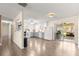 Open kitchen with white cabinetry, stainless appliances, and sliding glass door to the outside at 5005 Ne 22Nd Ave, Ocala, FL 34479