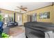 Sunroom with hot tub and view of the backyard through sliding glass door at 5005 Ne 22Nd Ave, Ocala, FL 34479