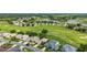 Beautiful aerial shot of a golf course community with lush green fairways and stunning homes at 5007 Kelso St, Leesburg, FL 34748