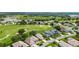 An aerial view of a lovely golf course community with homes lining the green fairways at 5007 Kelso St, Leesburg, FL 34748