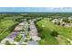 A beautiful aerial view of a residential neighborhood next to a lush green golf course at 5007 Kelso St, Leesburg, FL 34748