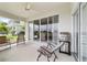 Outdoor space with ceiling fan, sliding glass doors, and stainless steel grill at 5007 Kelso St, Leesburg, FL 34748