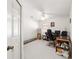Empty bright bedroom with white walls, a ceiling fan and carpeted floors at 5007 Kelso St, Leesburg, FL 34748