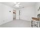 Empty bright bedroom featuring a ceiling fan and carpeted floor at 5007 Kelso St, Leesburg, FL 34748