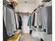 Walk-in closet with ample hanging space and shelves at 5007 Kelso St, Leesburg, FL 34748