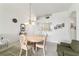 Dining room features a chandelier and seamlessly connects to the living area at 5007 Kelso St, Leesburg, FL 34748