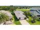 A well-maintained home with lush landscaping and a pristine lawn, enhancing its curb appeal at 5007 Kelso St, Leesburg, FL 34748