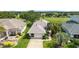 Charming single-story home featuring a well-maintained lawn, mature landscaping, and attached two car garage at 5007 Kelso St, Leesburg, FL 34748