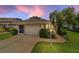 Charming single story home with a well-manicured lawn and 2 car garage at 5007 Kelso St, Leesburg, FL 34748