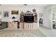 Living room featuring a TV, cabinets, and decor items at 5007 Kelso St, Leesburg, FL 34748