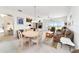 Open-concept living and dining area with sliding glass doors leading to outdoor space at 5007 Kelso St, Leesburg, FL 34748