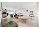 Bright living room featuring a dining area, ceiling fan, and sliding glass doors to the outside at 5007 Kelso St, Leesburg, FL 34748