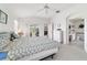 Spacious main bedroom featuring a view to the bathroom and backyard at 5007 Kelso St, Leesburg, FL 34748