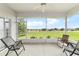 Enjoy serene views from the screened porch overlooking the lush greenery and neighborhood at 5007 Kelso St, Leesburg, FL 34748