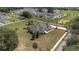 Aerial view of the property with large yard showcasing its curb appeal and landscaping at 5092 Ne 81St Blvd, Wildwood, FL 34785