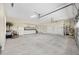 Spacious garage with ample storage, white cabinets, and room for multiple vehicles at 5092 Ne 81St Blvd, Wildwood, FL 34785