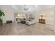 Spacious living room features wood floors, neutral decor, and lots of natural light at 5092 Ne 81St Blvd, Wildwood, FL 34785