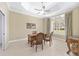 Home office features classic wood desk, tile floors, and ample natural light at 5092 Ne 81St Blvd, Wildwood, FL 34785