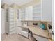 Bright office features custom built-ins, drawers, and counter-top workspace for all your organizational needs at 5092 Ne 81St Blvd, Wildwood, FL 34785