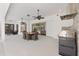 Spacious outdoor kitchen with grill, dining, and seating area under the covered patio at 5092 Ne 81St Blvd, Wildwood, FL 34785