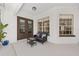 Cozy outdoor seating area with comfortable furniture and a view into the interior at 5092 Ne 81St Blvd, Wildwood, FL 34785