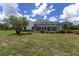 Screened porch and manicured landscaping enhance this home's outdoor living appeal at 5092 Ne 81St Blvd, Wildwood, FL 34785