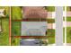 A bird's-eye view shows property lines and layout of the beautiful green backyard and neighboring homes at 5651 Nw 40Th Pl, Ocala, FL 34482
