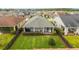Aerial view of a meticulously kept backyard, featuring well-manicured landscaping and a cozy outdoor seating area at 5651 Nw 40Th Pl, Ocala, FL 34482