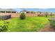 View of the well-maintained backyard featuring healthy green grass, and a privacy fence at 5651 Nw 40Th Pl, Ocala, FL 34482