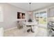 Bright dining area with sliding glass doors and a view of the outdoors at 5651 Nw 40Th Pl, Ocala, FL 34482