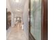 Bright foyer featuring decorative glass door, tiled floors, and an open view to the living spaces at 5651 Nw 40Th Pl, Ocala, FL 34482