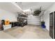 Spacious garage with overhead storage racks, a golf cart, and ample space for vehicles and projects at 5651 Nw 40Th Pl, Ocala, FL 34482