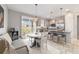 Dining area adjacent to kitchen with a view of the backyard from the sliding glass doors at 5651 Nw 40Th Pl, Ocala, FL 34482