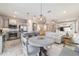 Open floor plan with kitchen island, dining area, and a bright living room at 5651 Nw 40Th Pl, Ocala, FL 34482