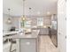 Bright eat-in kitchen features stainless steel appliances, pendant lighting, and a large center island at 5651 Nw 40Th Pl, Ocala, FL 34482