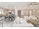 Open floor plan of living and dining area with views of kitchen and living room with custom built-ins at 5651 Nw 40Th Pl, Ocala, FL 34482